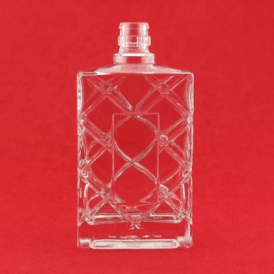 wholesale latest design embossed whisky glass bottle with customized logo