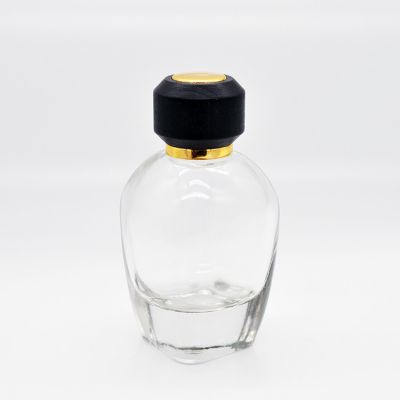 Modern design oval thick bottom glass perfume bottle 100ml with wooden cover