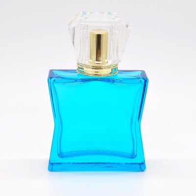 New design cheap 50ml Blue glass acrylic cap empty decorative perfume bottles for sale 