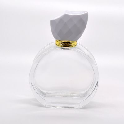 Wholesale cute design round 100ml perfume fancy glass bottles 