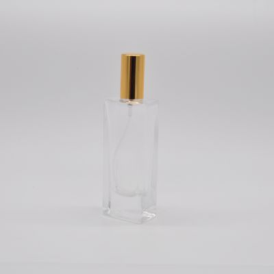 Empty wholesale 25ml high quality wholesale clear OEM rectangle glass perfume bottle with pump mist sprayer 