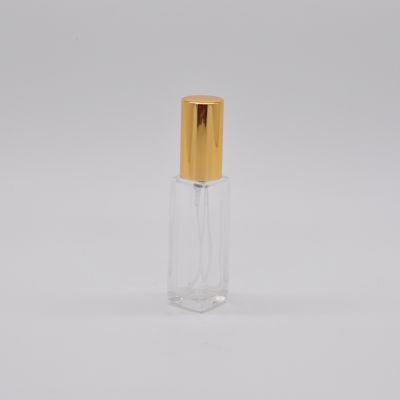 Empty designed high quality wholesale clear OEM rectangle 10ml refillable glass perfume bottle with pump sprayer gold cap 