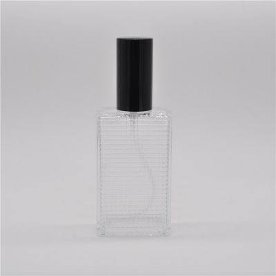 Empty 50ml 100ml high quality wholesale clear OEM rectangle refillable glass perfume bottle with pump mist sprayer 