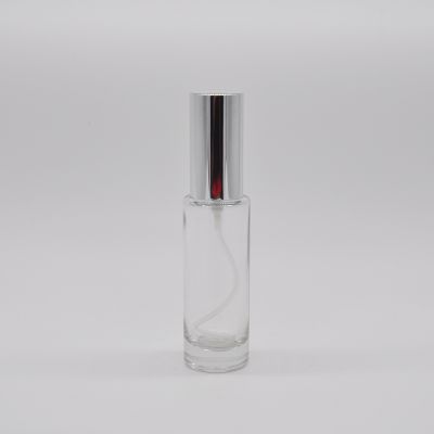 Empty wholesale high quality wholesale clear OEM 25ml cylinder refillable glass perfume bottle with pump mist sprayer 