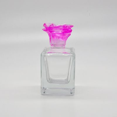 Hot selling new design Transparent luxury glass perfume bottle with flower cap