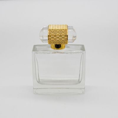 Wholesale 100ml elegant style glass luxury perfume bottle with unique cover 