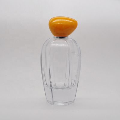 100 ml Empty high quality transparent OEM glass perfume bottle with mist sprayer yellow stone cap