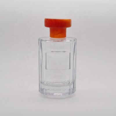 100 ml Empty high quality transparent OEM glass perfume bottle with yellow round stone cap 