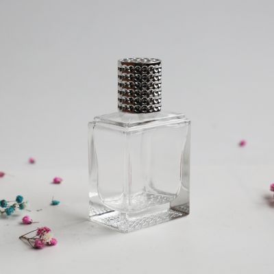 60ml transparent rectangle perfume glass bottle with plaid curve bottom 