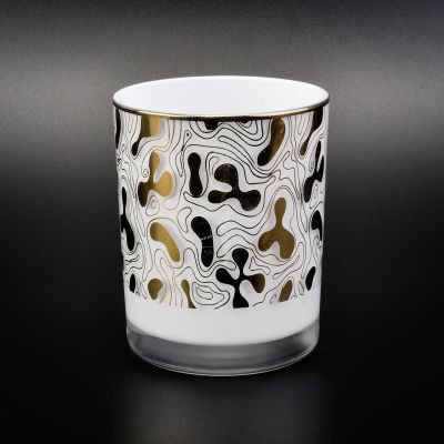 white glass candle container with gold prints