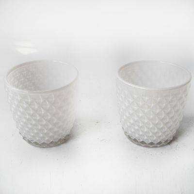 Various colors of empty glass candlestick containers with candle making