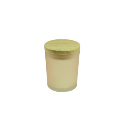 Round pink glass candle jar with wood lid