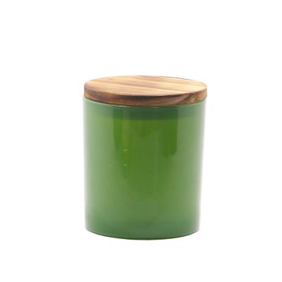 Glossy green glass candle jar wholesale candle holder with sealed wooden lid/smoked wooden lid/metal lid
