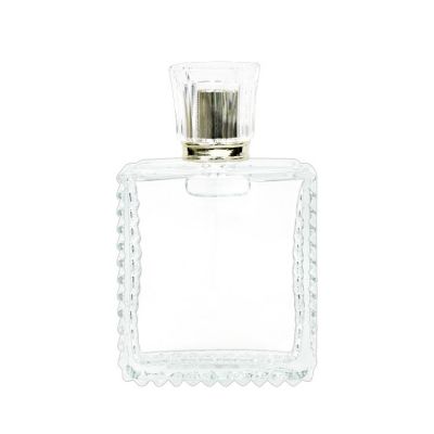 New design 100ml clear packaging square glass perfume bottle with gold aluminum mist sprayer and acrylic cap
