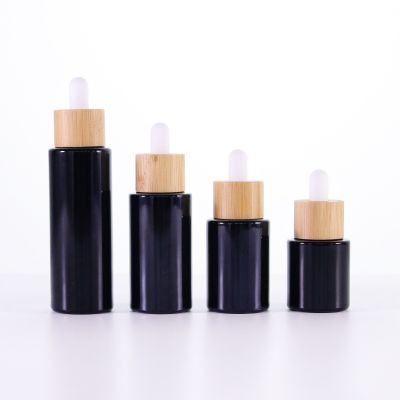 20ml 30ml 40ml round black essential oil cbd oil bottles with wooden cap cosmetic glass dropper bottles serum bottle