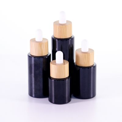 20ml 30ml 40ml round black essential oil cbd oil bottles with wooden cap cosmetic glass dropper bottles serum bottle