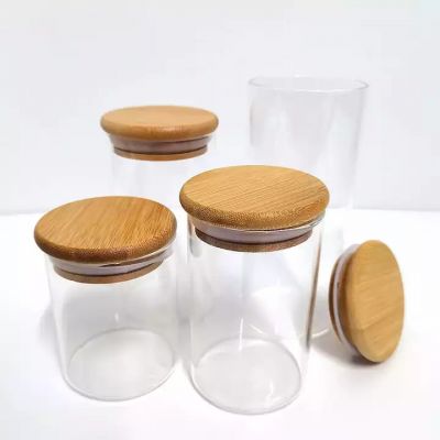 Wholesale Custom Cylinder Borosilicate Clear Glass Candle Jar Vessels with Bamboo Lid and Box for Soy Wax Scented Candle Making