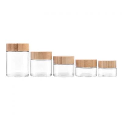 custom hot sale 25ml 55ml 75ml 110ml 170ml clear wide mouth cosmetics cream flower glass jar with bamboo child resistant lid