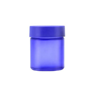 Hot sale fancy 85ml frosted blue cosmetic cream wide mouth empty packaging flower glass jar with blue childproof lid
