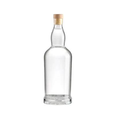 Wholesale customized hot selling circular transparent 750ml whiskey beverage juice spirit glass bottle with bottle cap