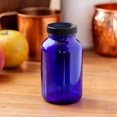 17 oz 4 oz Cobalt Glass Packer Bottle with Black Ribbed Lid