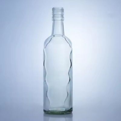 Factory sale transparent 560ml liquor whisky brandy gin glass bottle corrugated surface glass bottle with cork