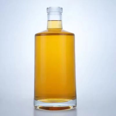 Wholesale round shaped 750ml glass bottle liquor glass bottle whisky brandy gin tequila glass bottle with cork top