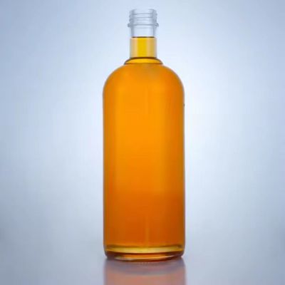 Classic round shaped 1026ml glass bottles whisky brandy glass bottle thin bottom glass bottle with screw cap