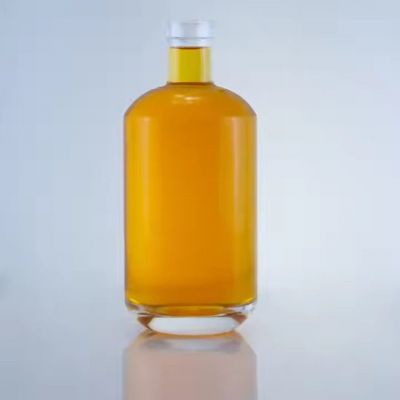 Quality assurance 750ml transparent whisky wine gin glass bottles round shaped glass bottles for alcoholic beverages