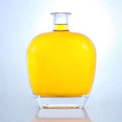 Custom transparent big belly 700ml glass bottle whiskey liquor vodka tequila glass bottles thick bottom bottle with cork