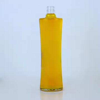 750 ml round with slightly wider on the sides than in the middle rum vodka gin brandy whiskey glass bottle with guala cap