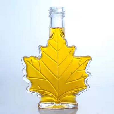 2022 Latest Leaf Shape Engraving Liquor Bottle Long Neck Rum Vodka Whiskey Glass Bottle