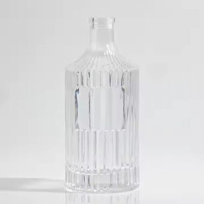 Innovative dense striped engraved embossed glass bottle