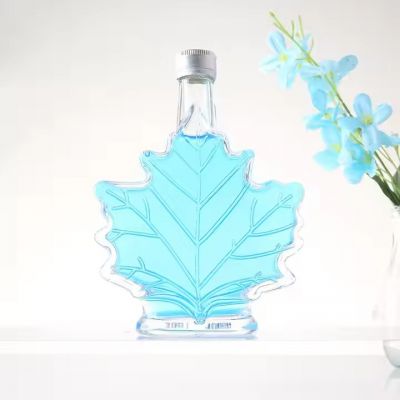 Creative Transparent Packaging Luxury 50ml 100ml 250ml Maple Leaf Glass Bottle for Wine Whisky Gin Beverage with Aluminum Lid